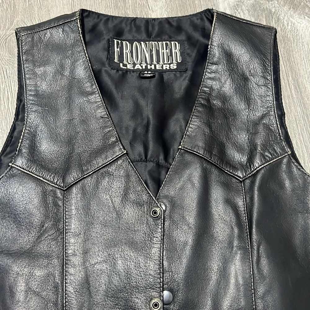Frontier Leather Men’s Vest w/ the “Harley Davidson” patch on the back. Size 42